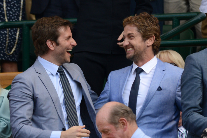 Bradley Cooper and Gerard Butler attend the Mens Singles Final on Day 13 of the Wimbledon Lawn Tennis Championships at the All England Lawn Tennis and Croquet Club on July 7, 2013 in London, England.