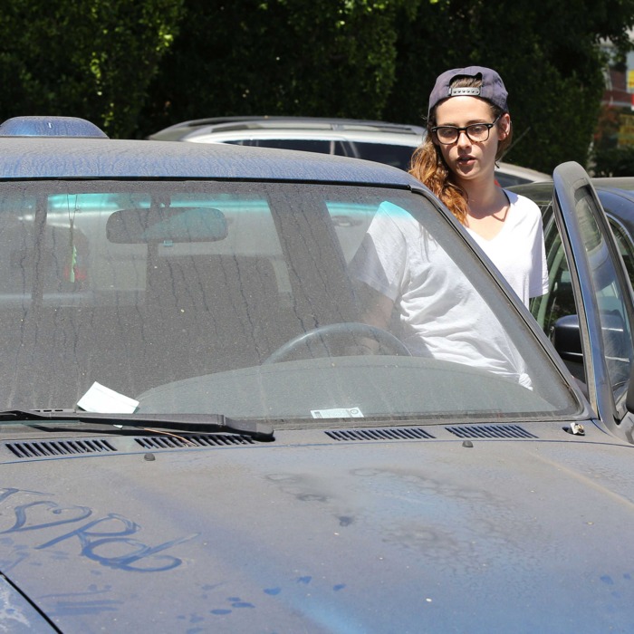 Kristen Stewart entering her truck, which has