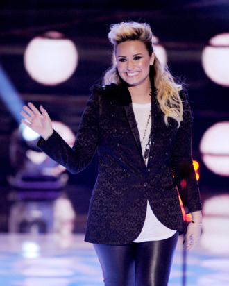UNIVERSAL CITY, CA - AUGUST 11: Singer Demi Lovato accepts the Choice Female Artist award onstage at the Teen Choice Awards 2013 at the Gibson Amphitheatre on August 11, 2013 in Universal City, California. (Photo by Kevin Winter/Getty Images)