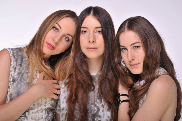 LONDON, ENGLAND - JUNE 01: (EXCLUSIVE COVERAGE. HIGHER RATES APPLY) (L-R) Alana Haim, Danielle Haim and Este Haim of HAIM pose for a portrait backstage at the "Chime For Change: The Sound Of Change Live" Concert at Twickenham Stadium on June 1, 2013 in London, England. Chime For Change is a global campaign for girls' and women's empowerment founded by Gucci with a founding committee comprised of Gucci Creative Director Frida Giannini, Salma Hayek Pinault and Beyonce Knowles-Carter. (Photo by Mick Hutson/Chime For Change/Getty Images for Gucci)