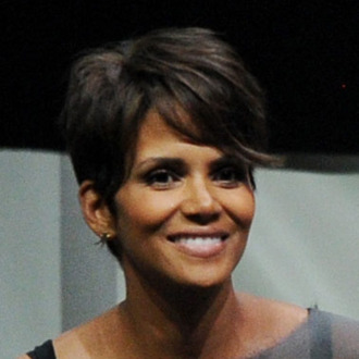 SAN DIEGO, CA - JULY 20: Actresses Halle Berry (L) and Anna Paquin speak at the 20th Century Fox panel during Comic-Con International 2013 at San Diego Convention Center on July 20, 2013 in San Diego, California. (Photo by Kevin Winter/Getty Images)
