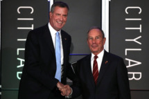 NEW YORK, NY - OCTOBER 08: Democratic nominee for New York Mayor Bill de Blasio (L) appears on stage with current New York Mayor Michael Bloomberg at