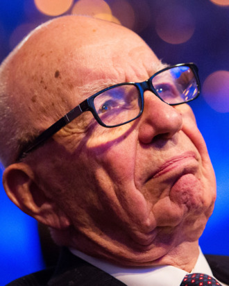 Rupert Murdoch listens to U.S. President Barack Obama make remarks at the Wall Street Journal CEO Council annual meeting, at the Four Seasons Hotel, on November 19, 2013, in Washington, DC. Obama discussed immigration reform and the health care rollout, among other topics.