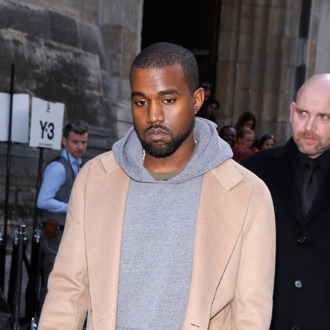 PARIS, FRANCE - JANUARY 19: Kanye West attends the Y-3 Menswear Fall/Winter 2014-2015 Show as part of Paris Fashion Week on January 19, 2014 in Paris, France. (Photo by Richard Bord/Getty Images)
