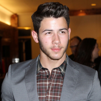 NEW YORK, NY - SEPTEMBER 09: Nick Jonas attends an Evening By Sherri Hill fashion show during Mercedes-Benz Fashion Week Spring 2014 at Trump Tower on September 9, 2013 in New York City. (Photo by Monica Schipper/Getty Images)
