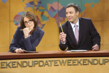 SATURDAY NIGHT LIVE -- Episode 4 -- Aired 11/02/2002 -- Pictured: (l-r) Tina Fey, Jimmy Fallon during "Weekend Update" -- Photo by: Mary Ellen Matthews/NBCU Photo Bank