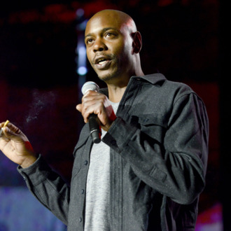 MOUNTAIN VIEW, CA - SEPTEMBER 20: Dave Chappelle performs as part of the The Oddball Comedy & Curiosity Festival at Shoreline Amphitheatre on September 20, 2013 in Mountain View, California. (Photo by Tim Mosenfelder/Getty Images)