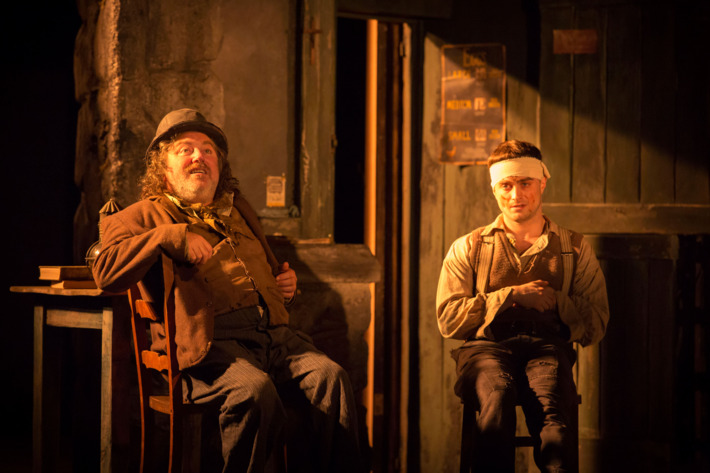 THE CRIPPLE OF INISHMAAN(l-r) Pat Shortt (Johnnypateenmike) and Daniel Radcliffe (Billy) in THE CRIPPLE OF INISHMAAN, by Martin McDonagh, directed by Michael Grandage. Previews April 12, opening April 20 at the Cort Theatre (138 West 48th Street).? Johan Persson