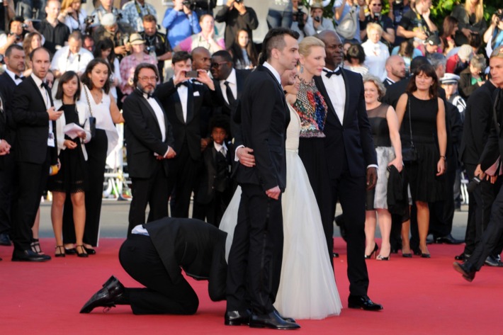 CANNES, FRANCE - MAY 16: A man invades the Red Carpet as Jay Baruchel, Kit Harington, America Ferrera, Cate Blanchett and Djimon Hounsou pose at the 'How To Train Your Dragon 2' premiere during the 67th Annual Cannes Film Festival on May 16, 2014 in Cannes, France.(Photo by Traverso/L'Oreal/Getty Images)
