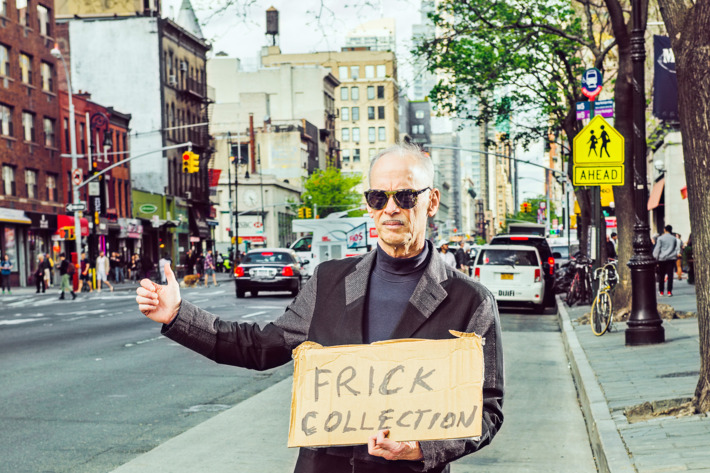 John Waters with his hitchhiking sign at 12th st and 6th ave