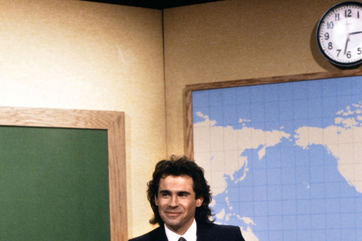 SATURDAY NIGHT LIVE -- Episode 4 -- Pictured: Dennis Miller during the 'Weekend Update' on November 15, 1986.