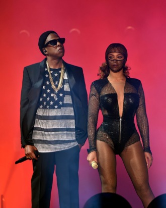 Jay-Z (L) and Beyonce perform during the