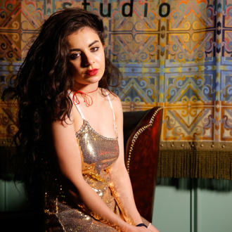LOS ANGELES, CA - JUNE 10: Charlotte Emma Aitchison aka Charli XCX poses in the green room for a portrait before the Sonos And Pandora Present