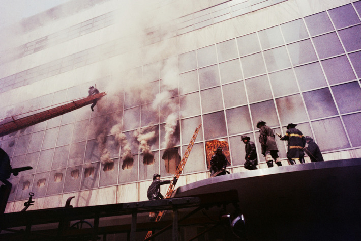 1958, Manhattan, New York City, New York State, USA --- Firemen combat a fire on the exterior facade of the Museum of Modern Art. The fire was started by welders during a renovation process. --- Image by ? Charles E. Rotkin/CORBIS