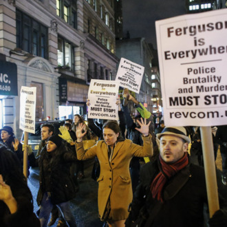 NEW YORK, NY - DECEMBER 3: People take part in a protest in Manhattan after a grand jury decided not to indict New York Police Officer Daniel Pantaleo in Eric Garner's death on December 3, 2014 in New York City. Eric Garner was killed by a police officer Daniel Pantaleo on July 17, 2014 after Pantaleo suspected him of selling untaxed cigarettes and putting him in a choke hold. (Photo by Kena Betancur/Getty Images)