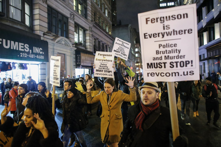 NEW YORK, NY - DECEMBER 3: People take part in a protest in Manhattan after a grand jury decided not to indict New York Police Officer Daniel Pantaleo in Eric Garner's death on December 3, 2014 in New York City. Eric Garner was killed by a police officer Daniel Pantaleo on July 17, 2014 after Pantaleo suspected him of selling untaxed cigarettes and putting him in a choke hold. (Photo by Kena Betancur/Getty Images)