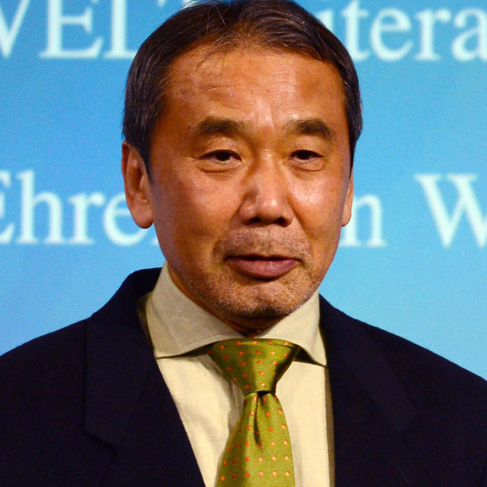 Japanese writer Haruki Murakami poses with his trophy prior to an award ceremony for the Germany's Welt Literature Prize bestowed by the German daily Die Welt, in Berlin on November 7, 2014. AFP PHOTO / JOHN MACDOUGALL (Photo credit should read JOHN MACDOUGALL/AFP/Getty Images)