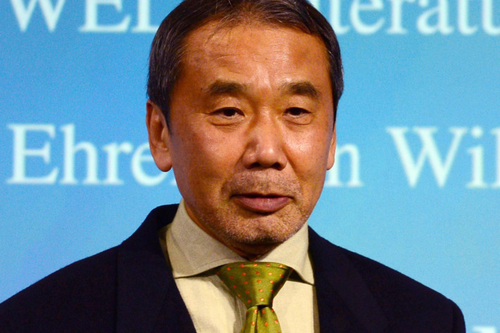 Japanese writer Haruki Murakami poses with his trophy prior to an award ceremony for the Germany's Welt Literature Prize bestowed by the German daily Die Welt, in Berlin on November 7, 2014. AFP PHOTO / JOHN MACDOUGALL (Photo credit should read JOHN MACDOUGALL/AFP/Getty Images)