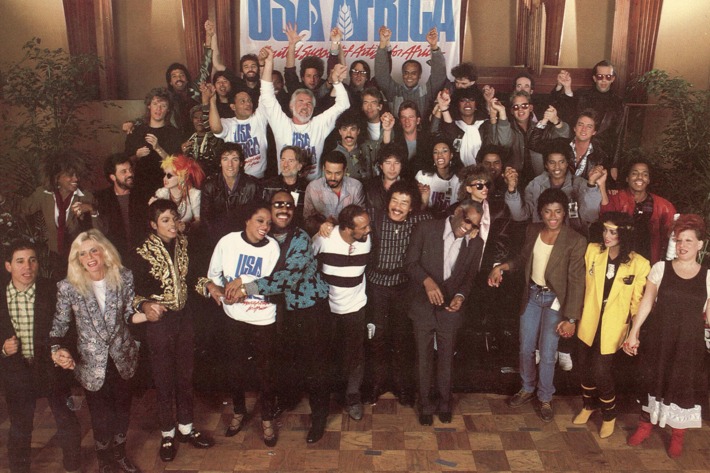 Front cover of the 'USA for Africa We are the World' record album, the music on which was designed to raise awareness and funds for a worldwide hunger relief program, 1985. The sleeve features a group photograph of the number of the contributing performers. The records success led the way for the Live Aid concerts later that year. (Photo by Blank Archives/Getty Images)