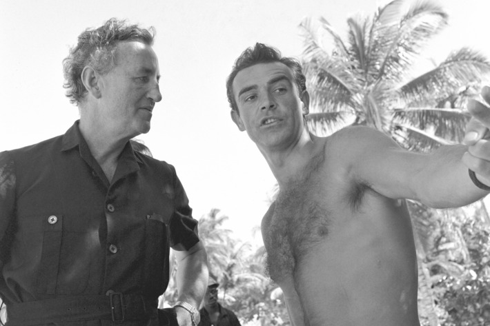 During location filming in Jamaica, Ian Fleming gives SEAN CONNERY some first-hand pointers on his portrayal of James Bond, Fleming's Agent 007.