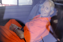 Robert Durst is transported from Orleans Parish Criminal District Court to the Orleans Parish Prison after his arraignment in New Orleans, Tuesday, March 17, 2015. Durst was rebooked on charges of being a convicted felon in possession of a firearm, and possession of a weapon with a controlled dangerous substance, a small amount of marijuana. (AP Photo/Gerald Herbert)
