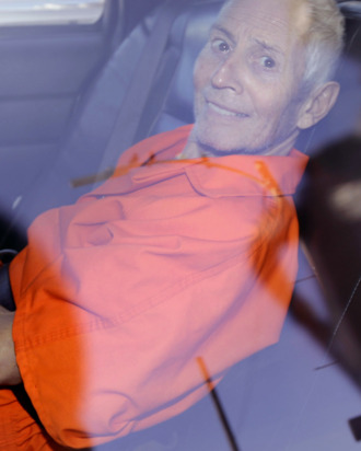 Robert Durst is transported from Orleans Parish Criminal District Court to the Orleans Parish Prison after his arraignment in New Orleans, Tuesday, March 17, 2015. Durst was rebooked on charges of being a convicted felon in possession of a firearm, and possession of a weapon with a controlled dangerous substance, a small amount of marijuana. (AP Photo/Gerald Herbert)