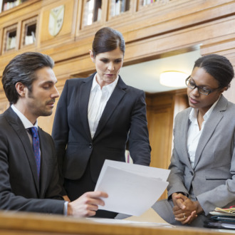 Lawyers examining documents in court