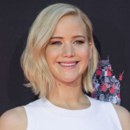 Actress Lawrence from the upcoming movie "The Hunger Games: Mockingjay - Part 2" poses at her hand and footprints ceremony in the forecourt of the TCL Chinese theatre in Hollywood