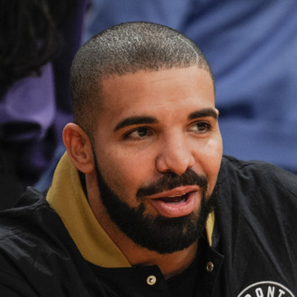Celebrities At The Los Angeles Lakers Game