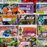 Rack of comic books for sale at a flea market