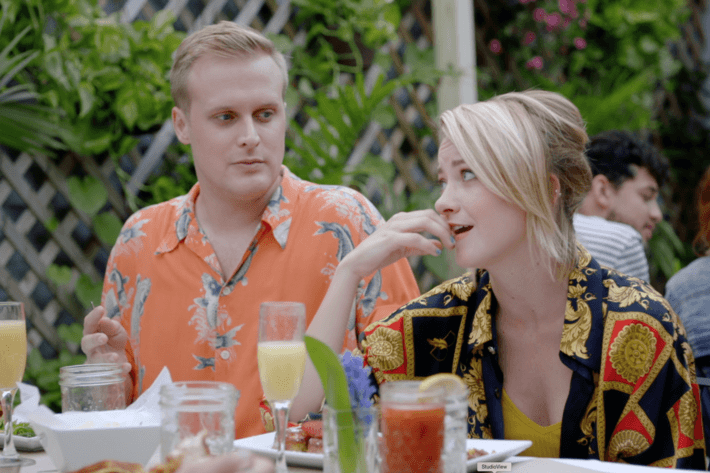 John Early as Elliott, Meredith Hagner as Portia.