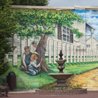 Mural depicting actors in the play and book, To Kill a Mockingbird. Located in historic downtown Mon