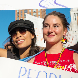 Rosario Dawson (left) and Shailene Woodley (center) pose for