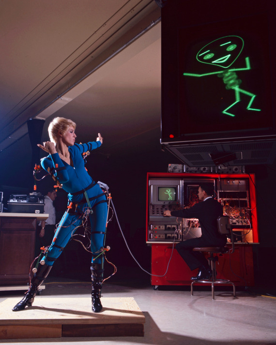 A Turn-On dancer, seen using a primitive form of motion capture to render the stick figure on the monitor.
