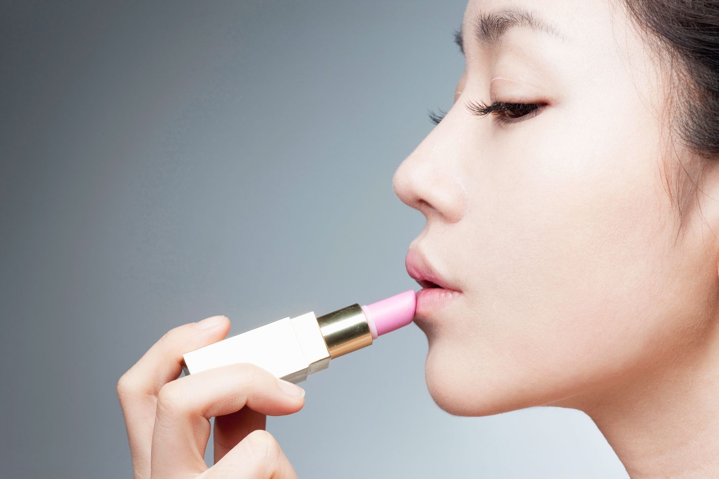 A Portrait Of Young Woman Putting On Lipstick, Korean