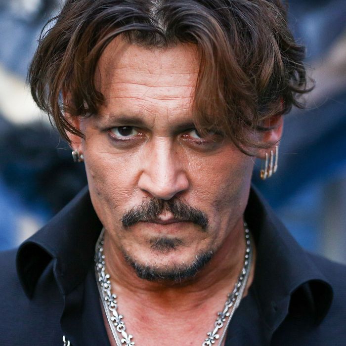 Johnny Depp Reportedly Spent $7000 on a Kardashian Kouch