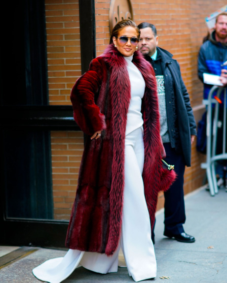 Jennifer Lopez in burgundy fur coat.