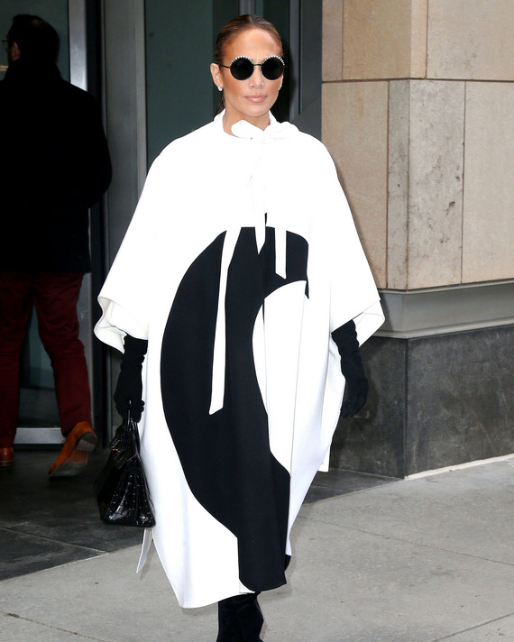 Jennifer Lopez in a black and white coat.