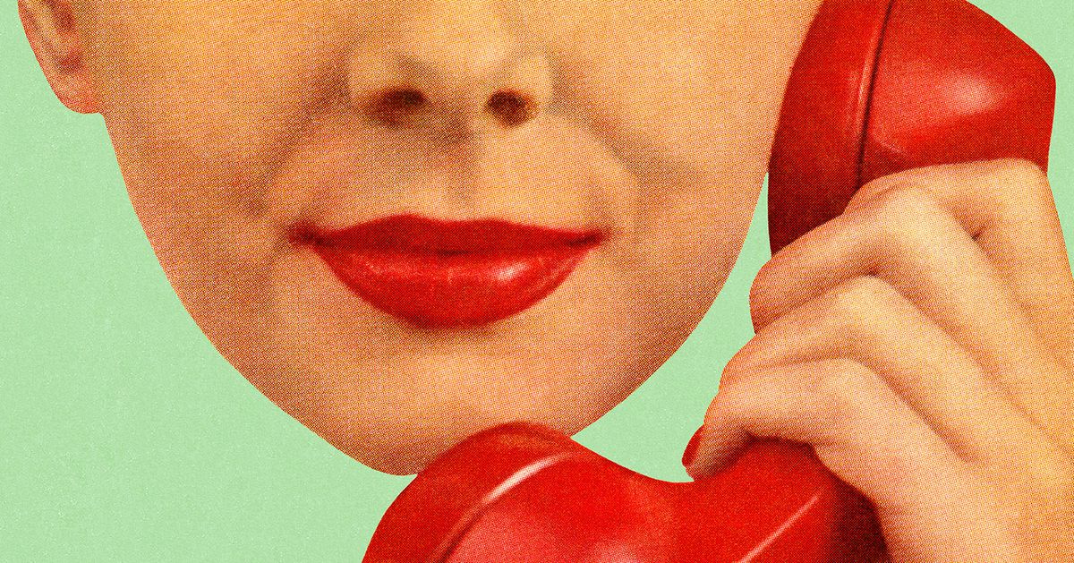 Woman Holding Red Phone to Hear Ear