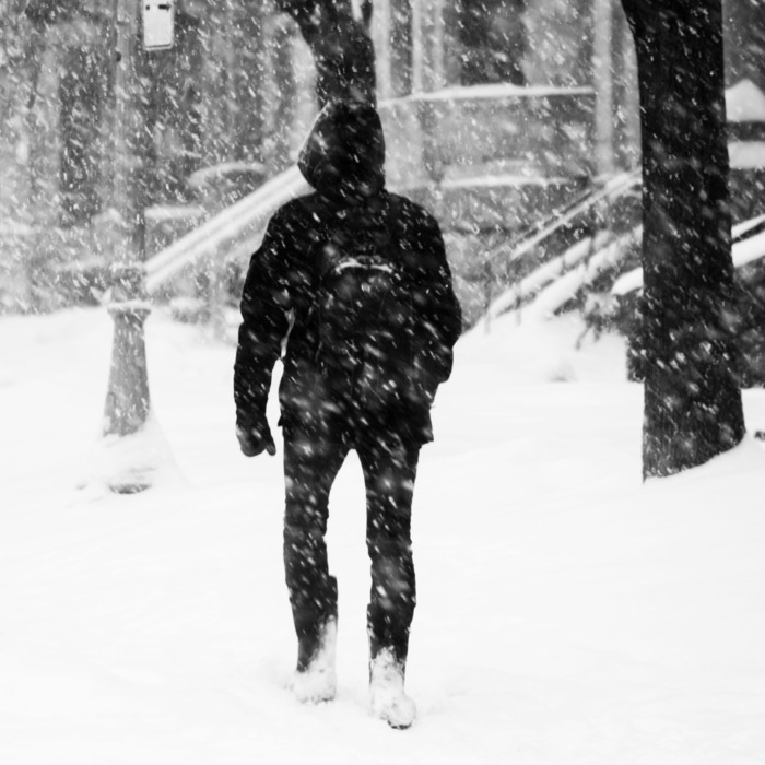 Student walking outside during winter.