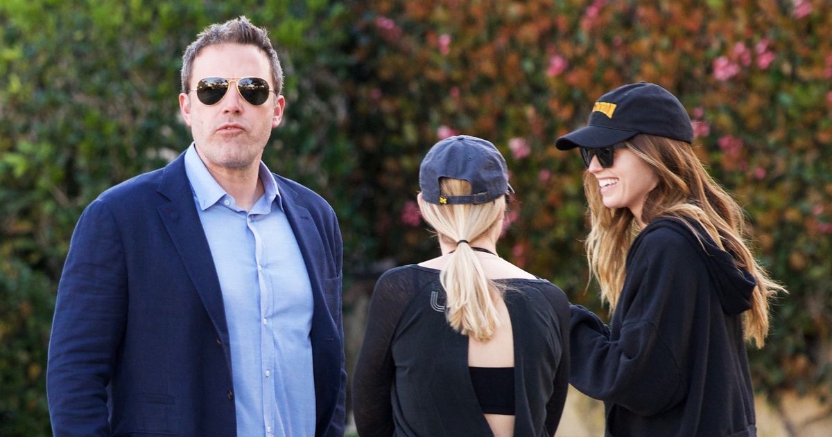 Ben Affleck passes by Katherine Schwarzenegger after dropping his kids off at school