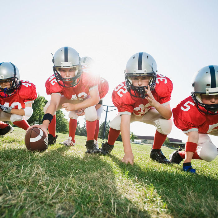 Boys playing football.
