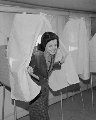 11 Dec 1979, San Francisco, California, USA --- Original caption: San Francisco: Incumbent Mayor Dianne Feinstein emerges from voting booth after casting her ballot December 11th, 1979, in a runoff election for mayor of San Francisco, between herself and supervisor Quentin Kopp. In the first round of the municipal elections November 6th, 1979, Feinstein got 42% of the vote to Kopp's 40% with the remainder going to a gay Realtor & minor candidates. --- Image by © Bettmann/CORBIS